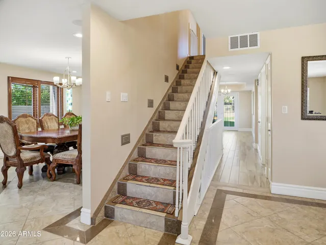 a view of a storage and utility room with washer and dryer