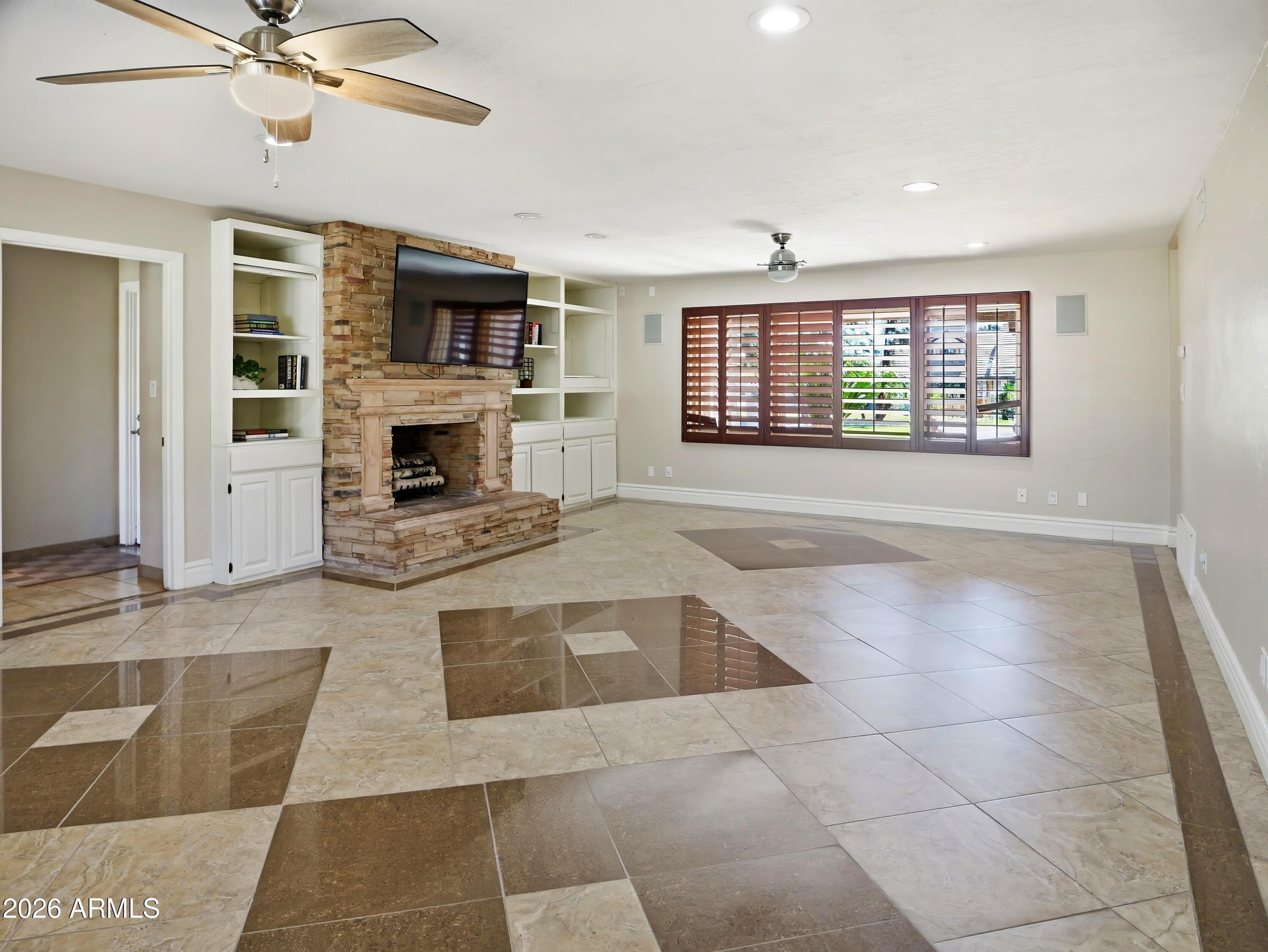 3154 East Inverness Avenue Mesa, AZ 85204 - Photo 15 of 70 a living room with furniture and a fireplace