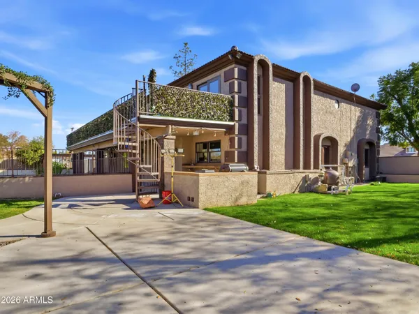 a white toilet sitting next to a bath tub