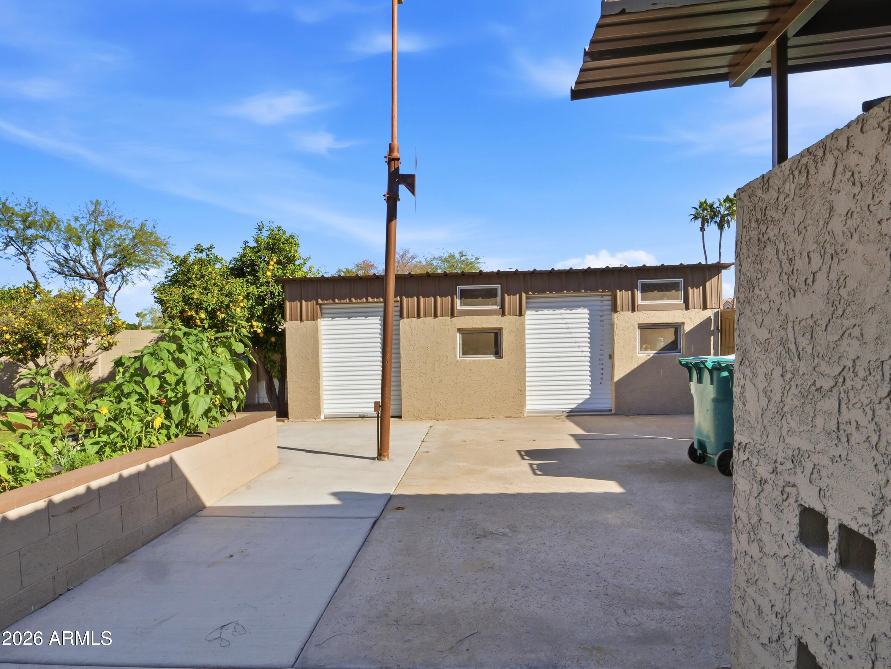 3154 East Inverness Avenue Mesa, AZ 85204 - Photo 35 of 70 a front view of a house with a yard and potted plants