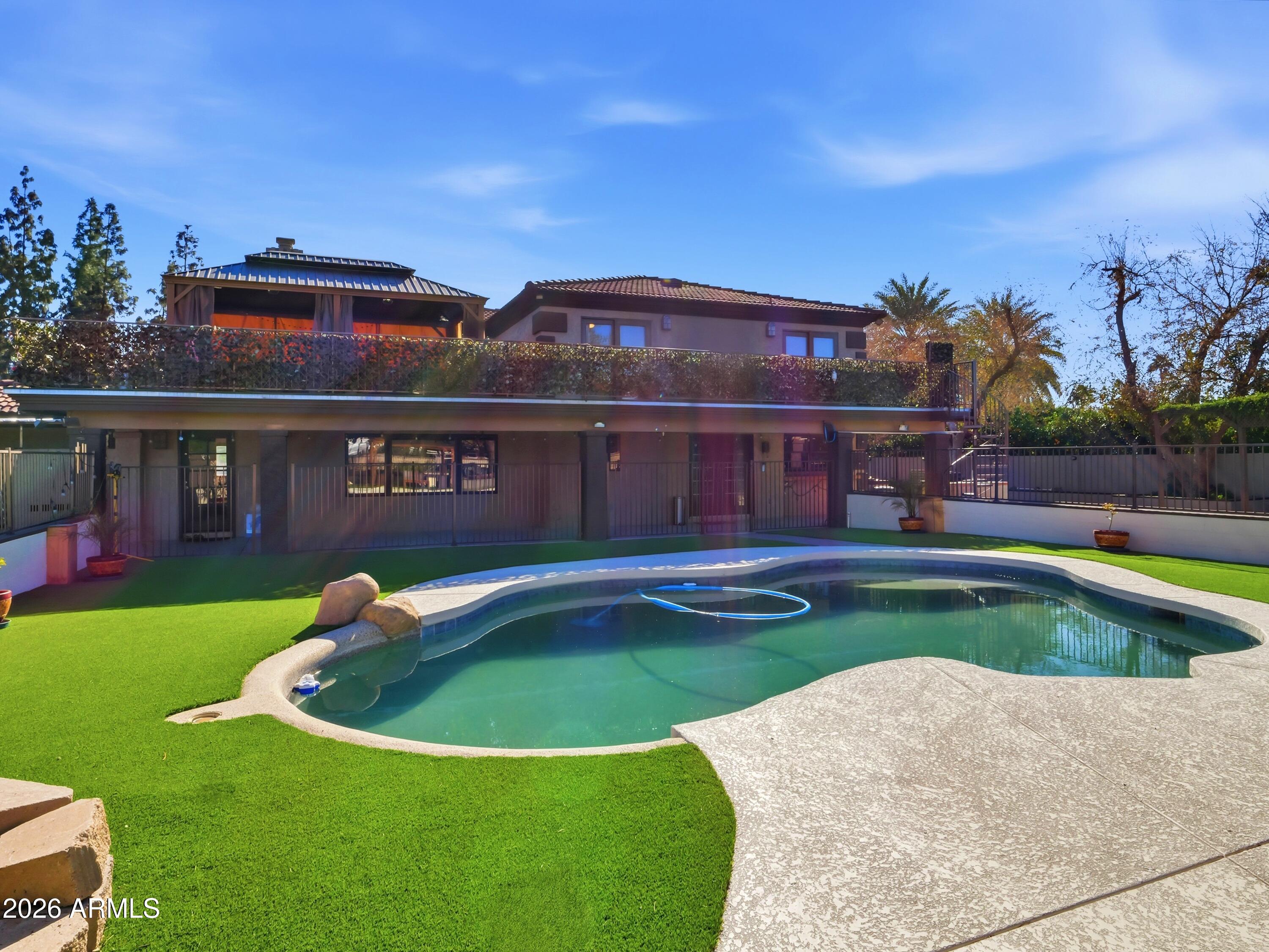 3154 East Inverness Avenue Mesa, AZ 85204 - Photo 36 of 70 a view of a house with swimming pool