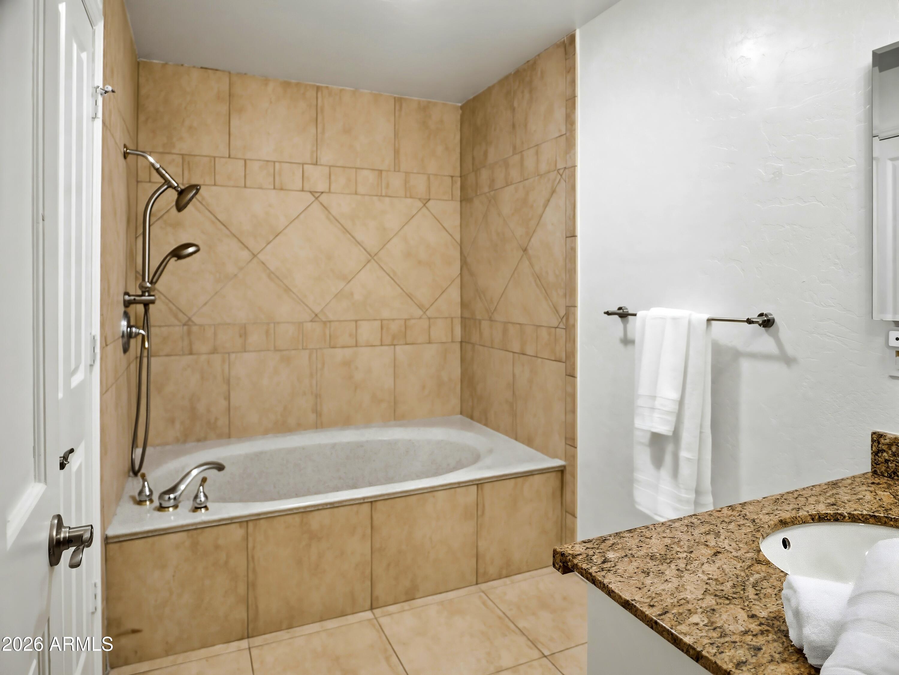 3154 East Inverness Avenue Mesa, AZ 85204 - Photo 46 of 70 a bathroom with a tub and shower
