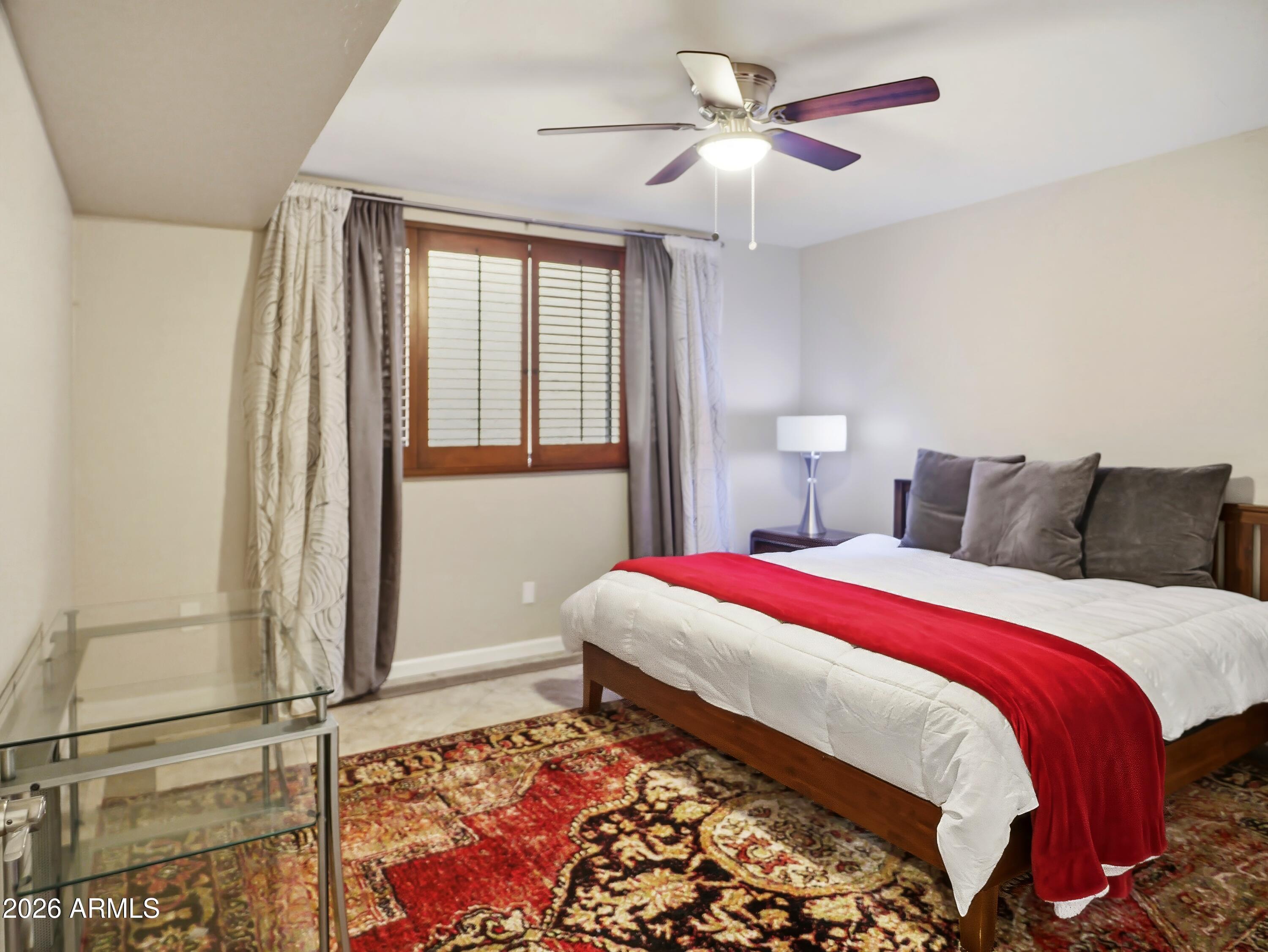 3154 East Inverness Avenue Mesa, AZ 85204 - Photo 48 of 70 a bedroom with a bed and a chandelier