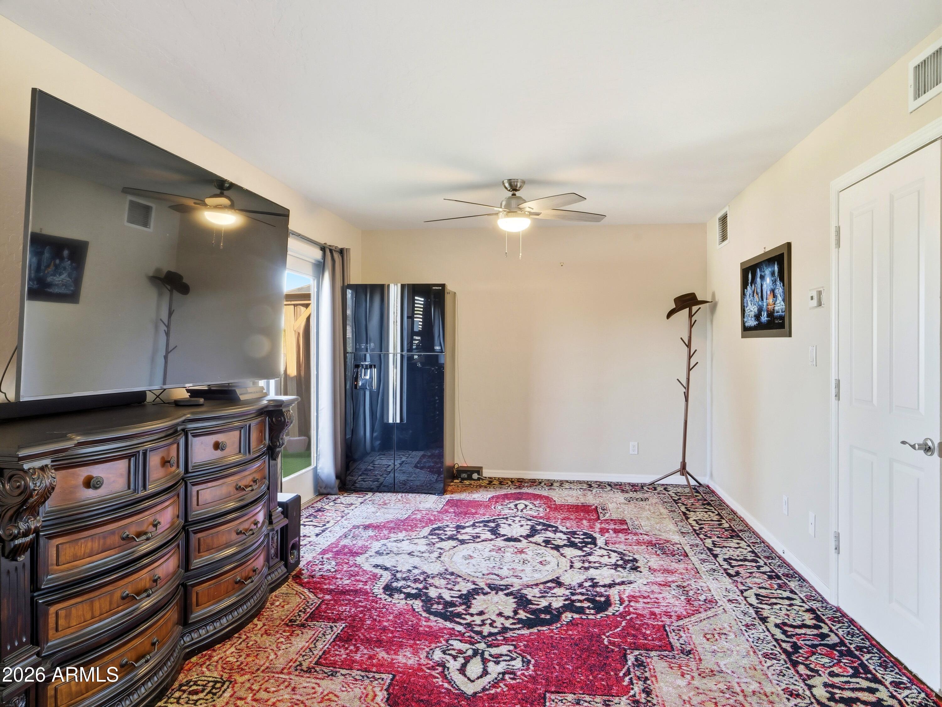 3154 East Inverness Avenue Mesa, AZ 85204 - Photo 51 of 70 a bedroom with a bed and a dresser in it