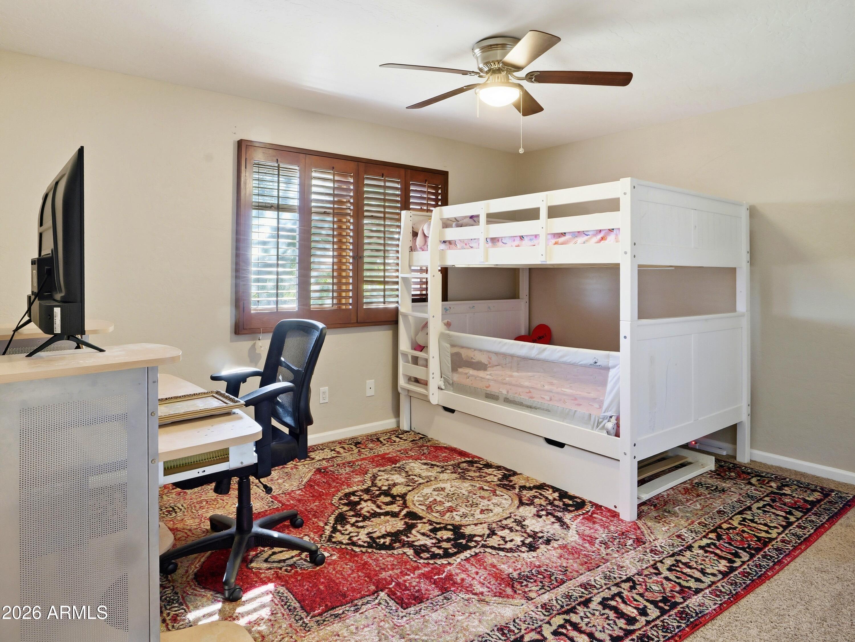 3154 East Inverness Avenue Mesa, AZ 85204 - Photo 63 of 70 a bed room with a bed and a chair