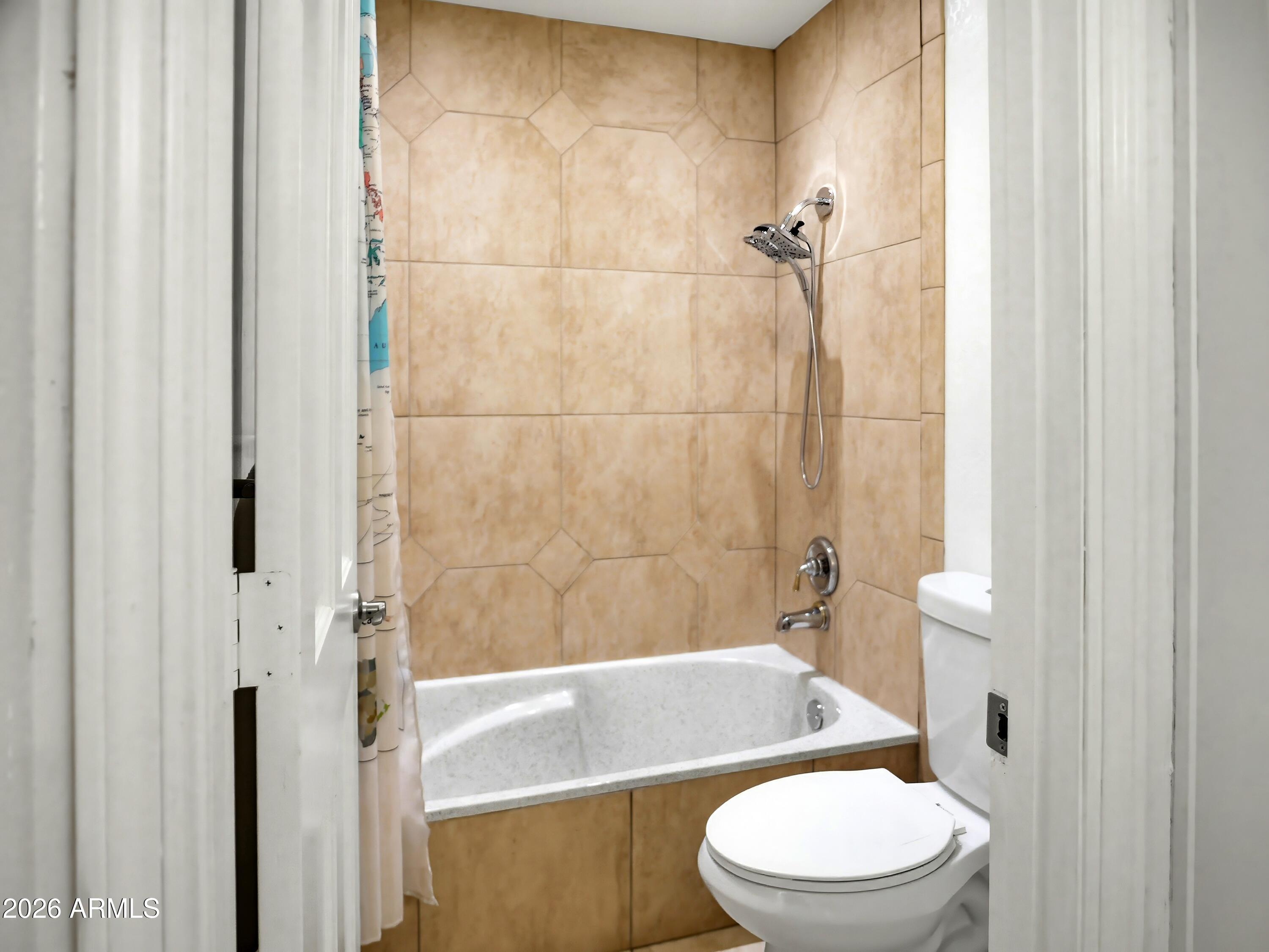 3154 East Inverness Avenue Mesa, AZ 85204 - Photo 65 of 70 a white toilet sitting next to a bath tub