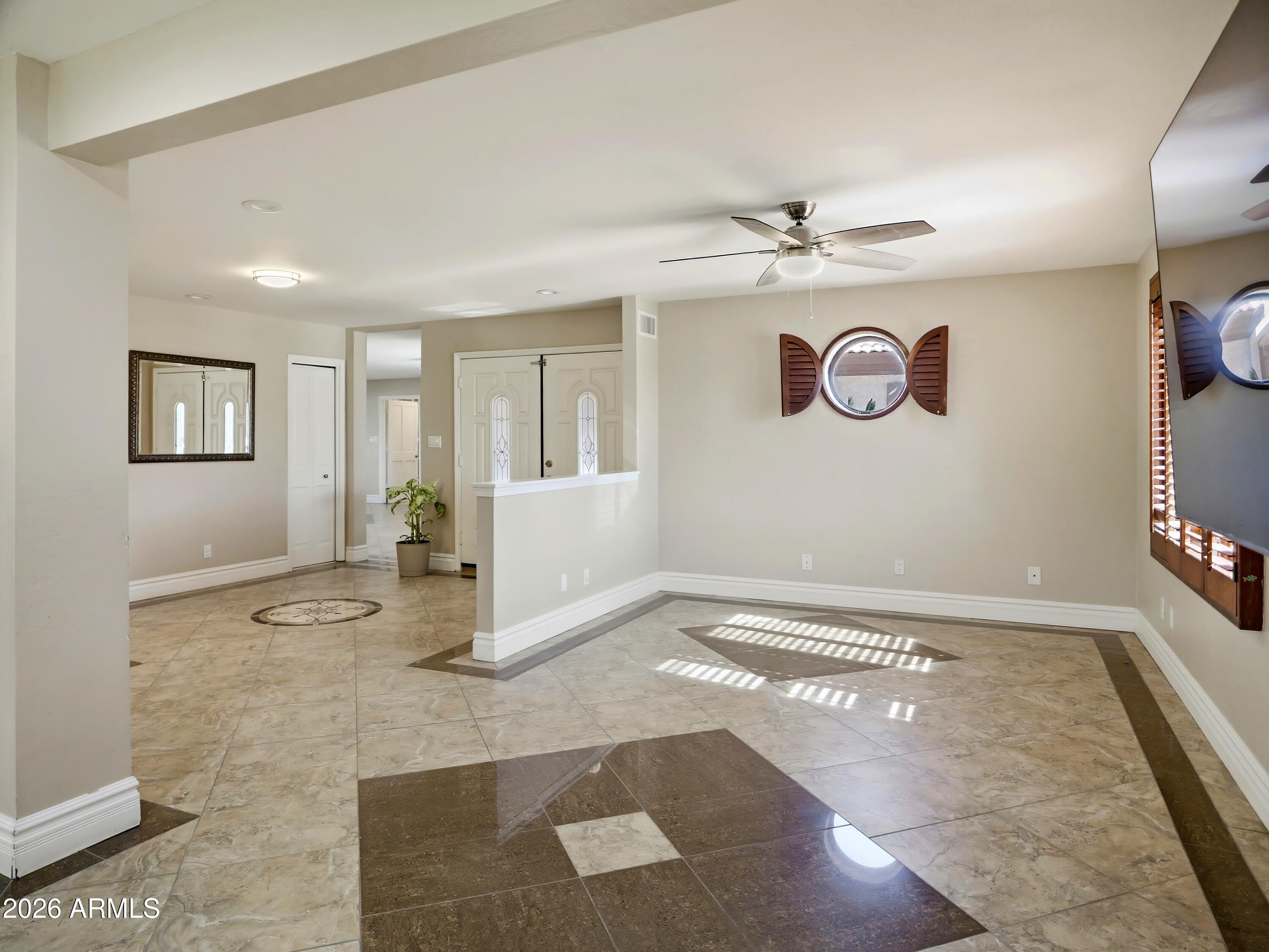 3154 East Inverness Avenue Mesa, AZ 85204 - Photo 8 of 70 a view of a livingroom with kitchen and a window