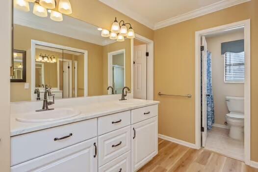 486 Ridge Lake Road Crestview, FL 32536 - Photo 39 of 87 a bathroom with a sink a toilet and a large mirror