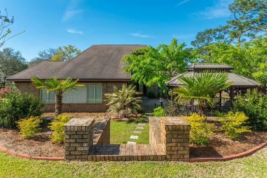 486 Ridge Lake Road Crestview, FL 32536 - Photo 5 of 87 a view of a house with a yard