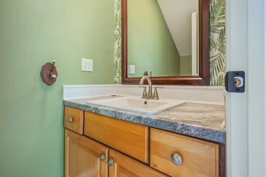 486 Ridge Lake Road Crestview, FL 32536 - Photo 74 of 87 a bathroom with a granite countertop sink and a mirror