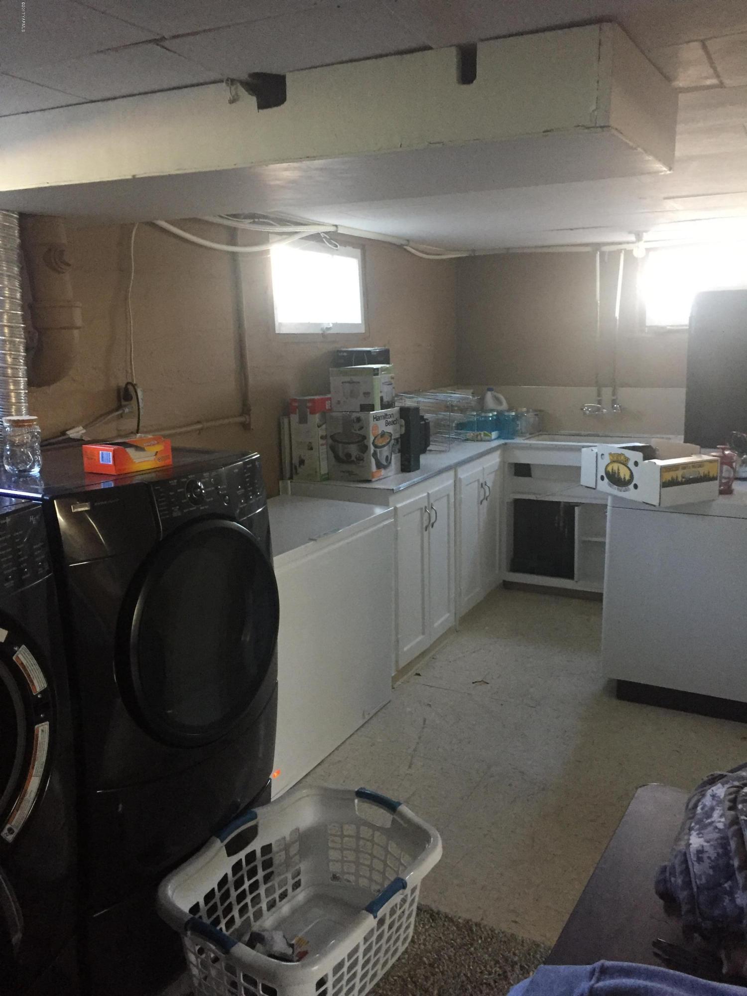 431 Allan Road Naches, WA 98937 - Photo 22 of 50 a kitchen with sink cabinets and stove top oven