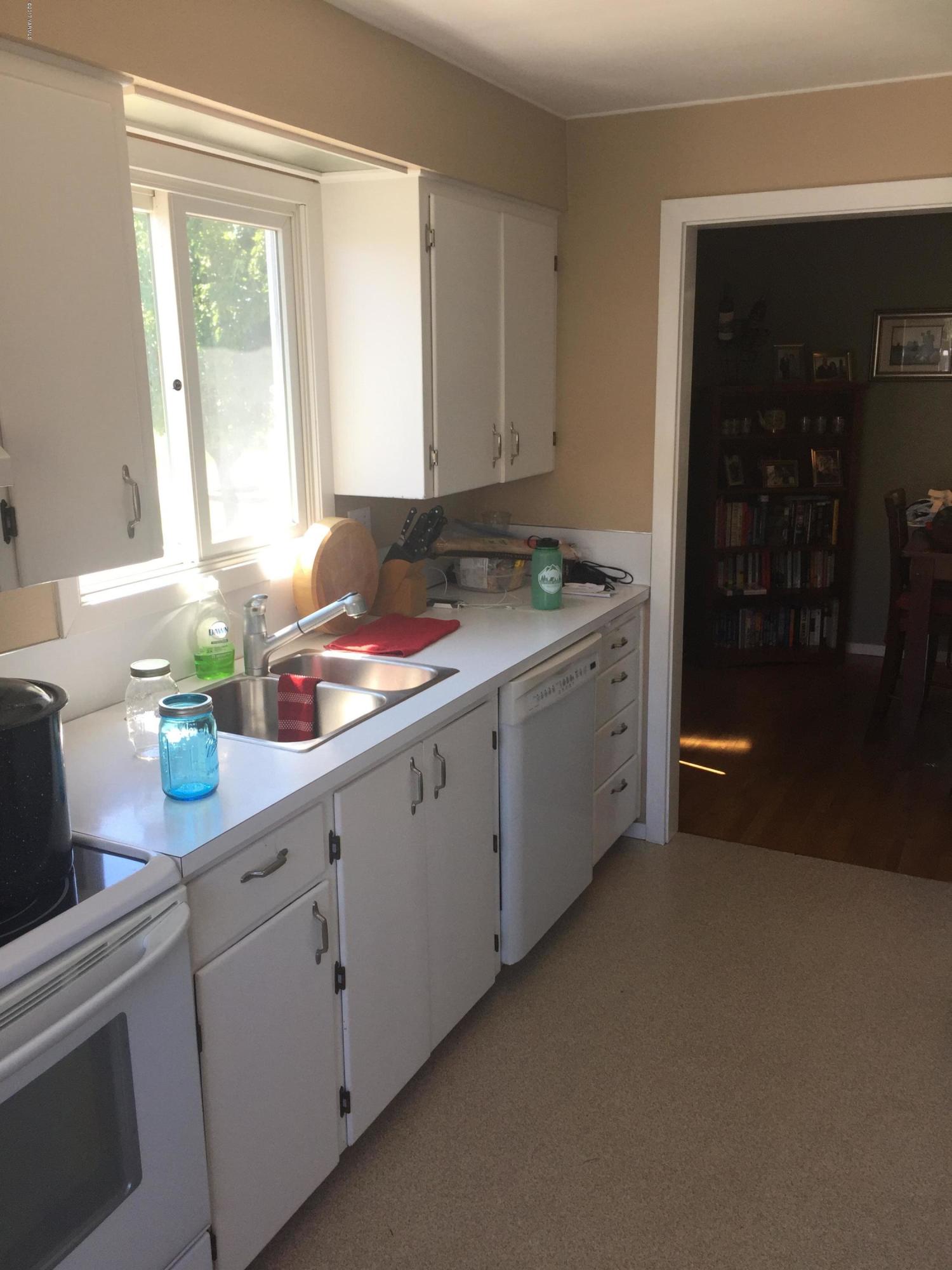 431 Allan Road Naches, WA 98937 - Photo 26 of 50 a kitchen with a sink cabinets and window