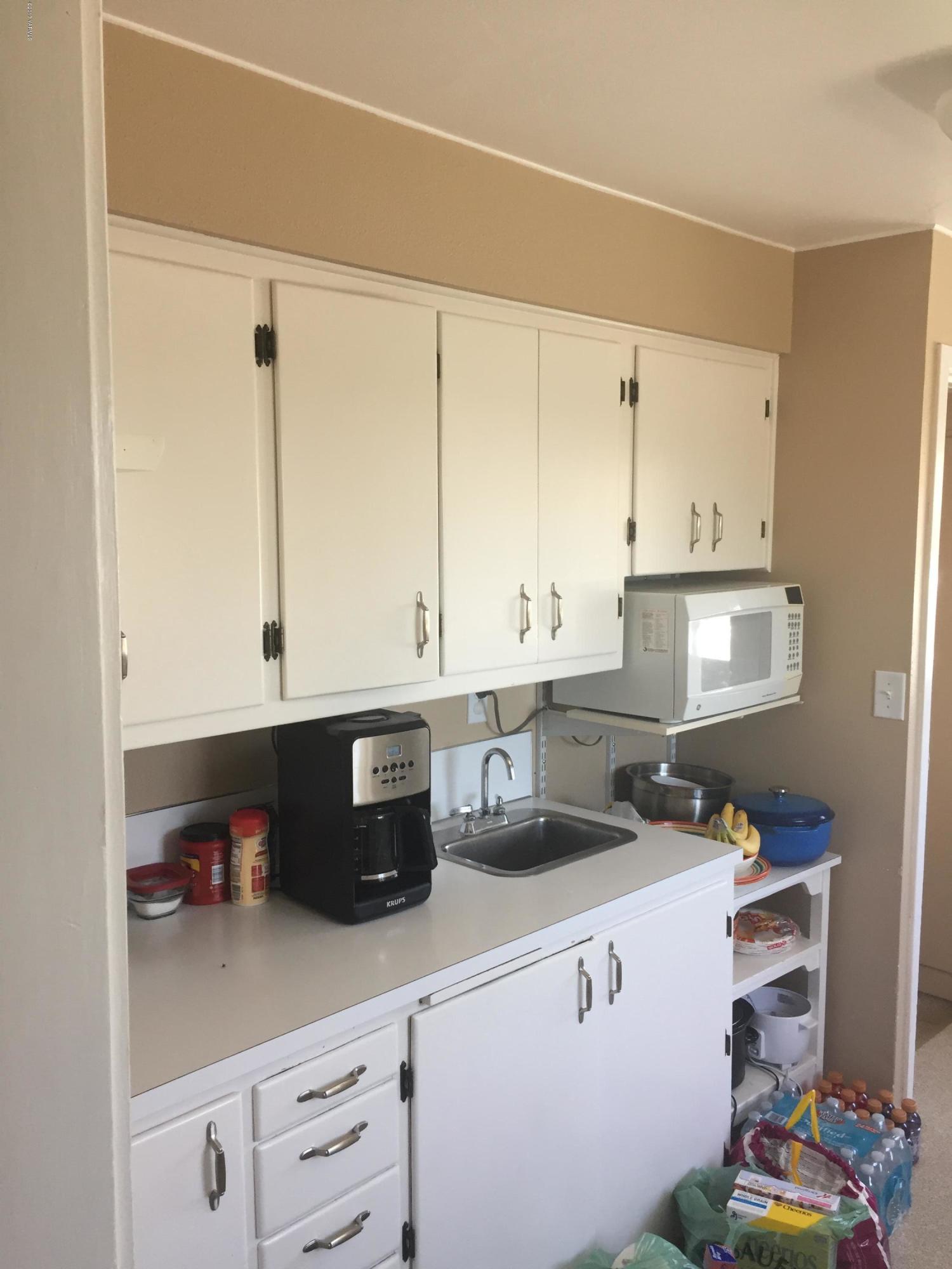 431 Allan Road Naches, WA 98937 - Photo 27 of 50 a kitchen with stainless steel appliances white cabinets and a sink