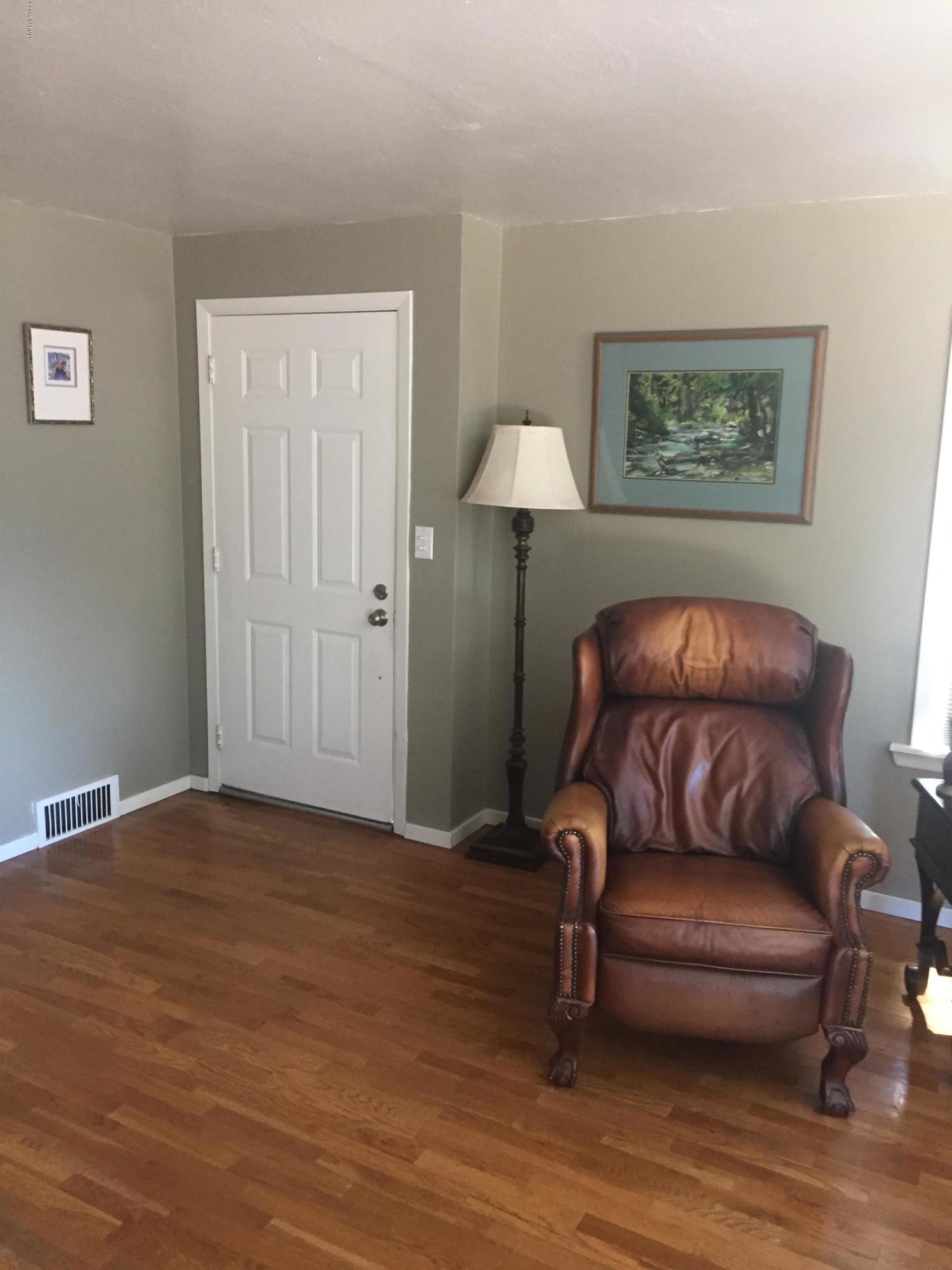 431 Allan Road Naches, WA 98937 - Photo 32 of 50 a living room with furniture and a wooden floor
