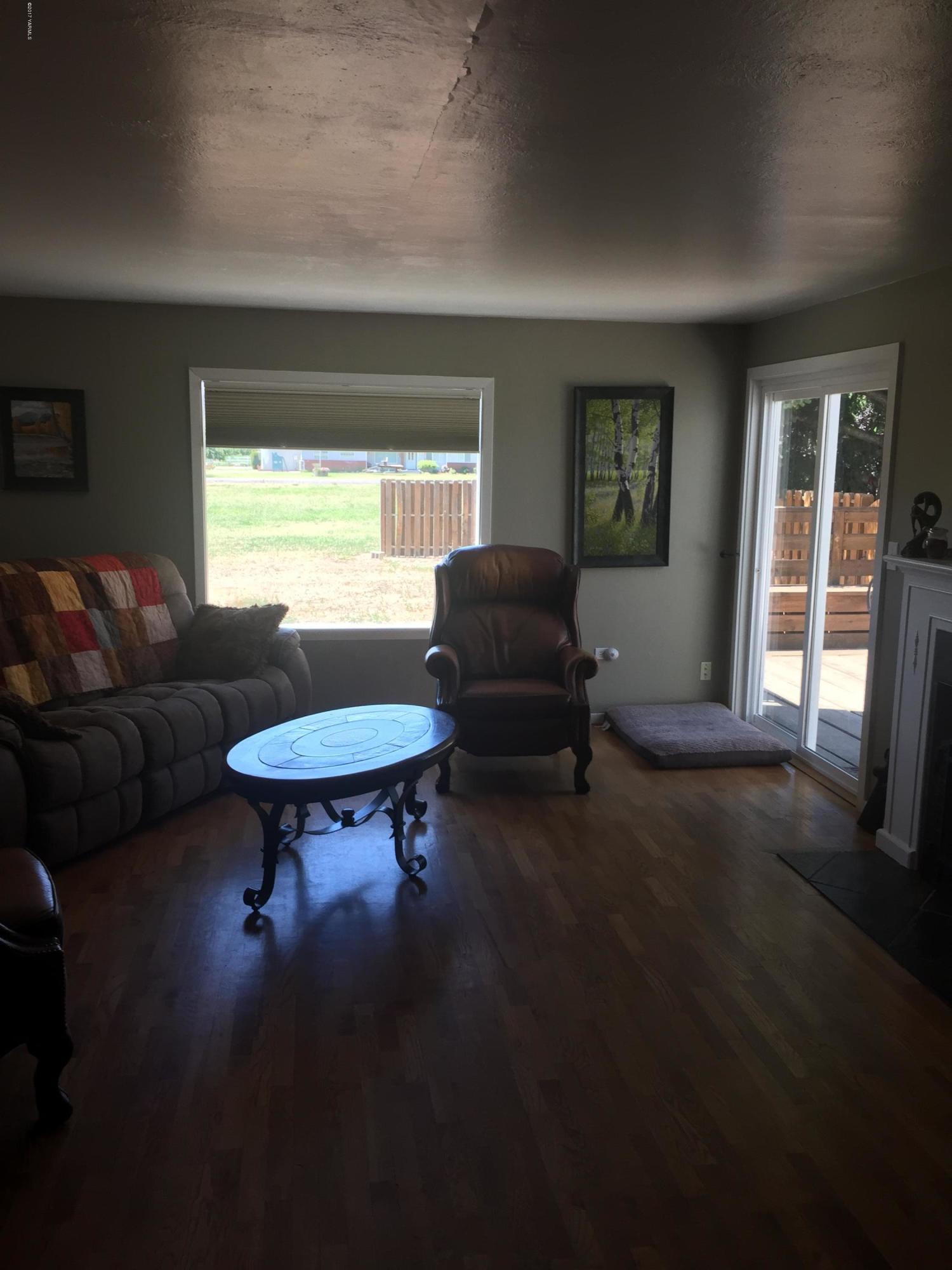 431 Allan Road Naches, WA 98937 - Photo 34 of 50 a living room with furniture a window and a flat screen tv