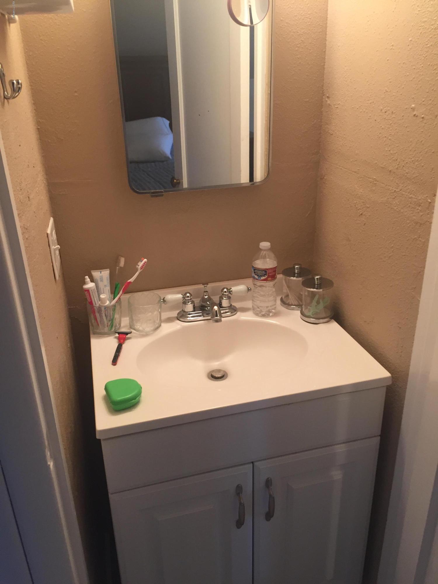 431 Allan Road Naches, WA 98937 - Photo 46 of 50 a bathroom with a sink and a mirror