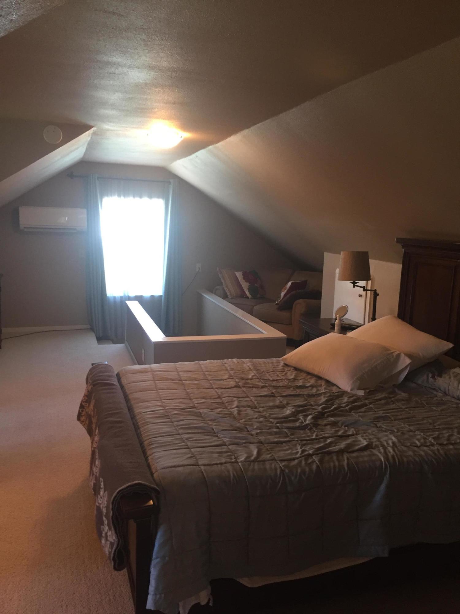 431 Allan Road Naches, WA 98937 - Photo 50 of 50 a bed sitting in a bedroom next to a window