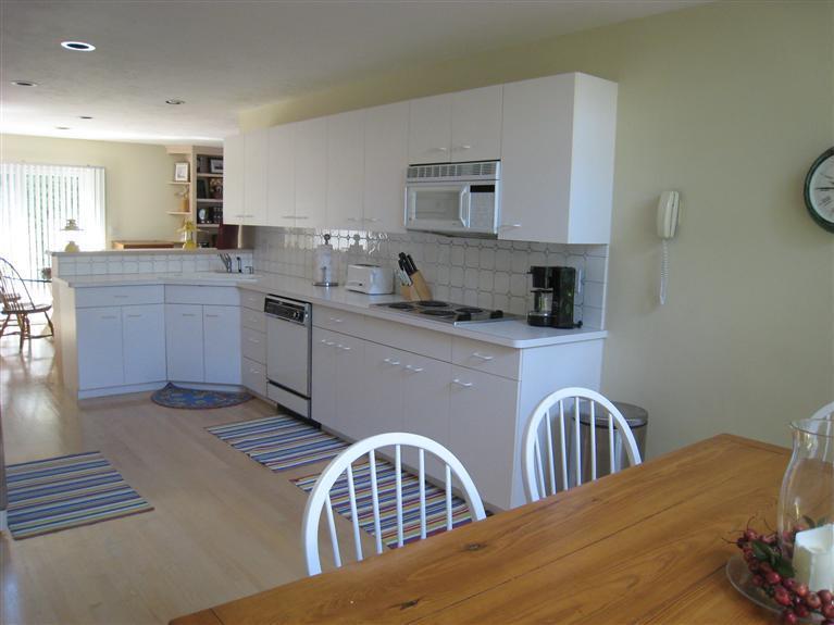 39 Summersea Road Mashpee, MA 02649 - Photo 13 of 18 a kitchen with a sink a stove and cabinets