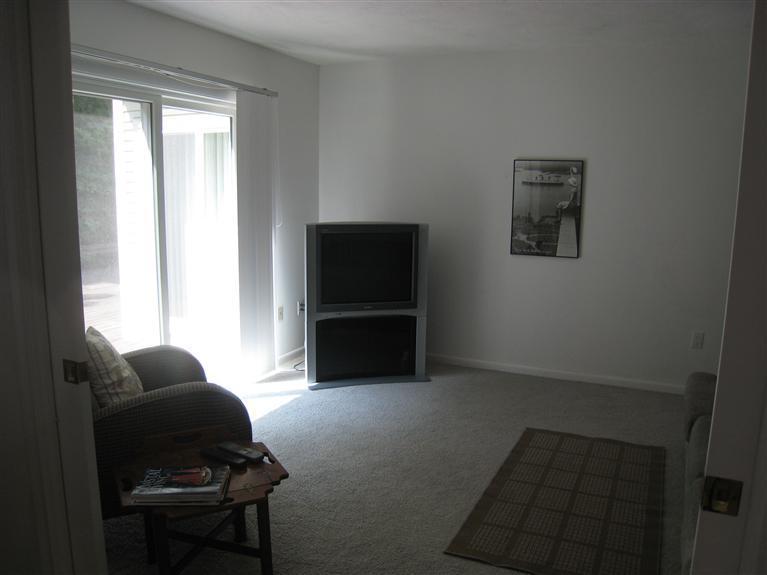 39 Summersea Road Mashpee, MA 02649 - Photo 15 of 18 a living room with furniture and a flat screen tv