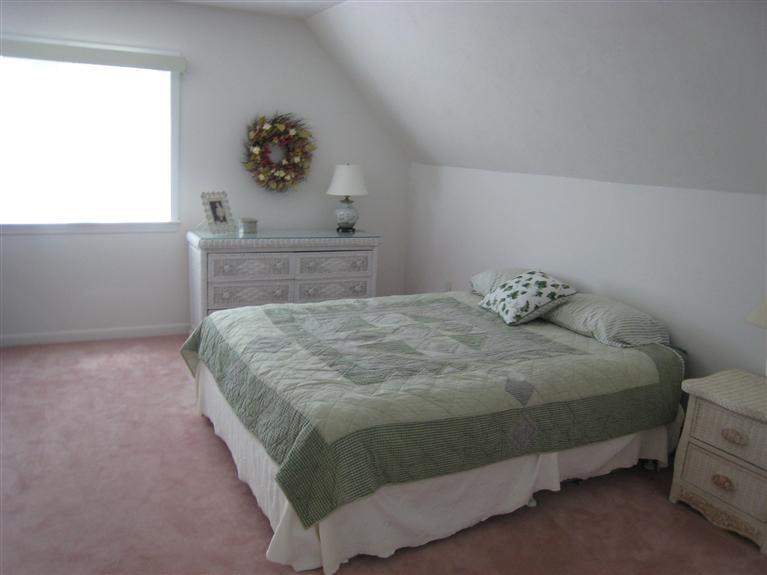 39 Summersea Road Mashpee, MA 02649 - Photo 16 of 18 a bedroom with a bed and a window