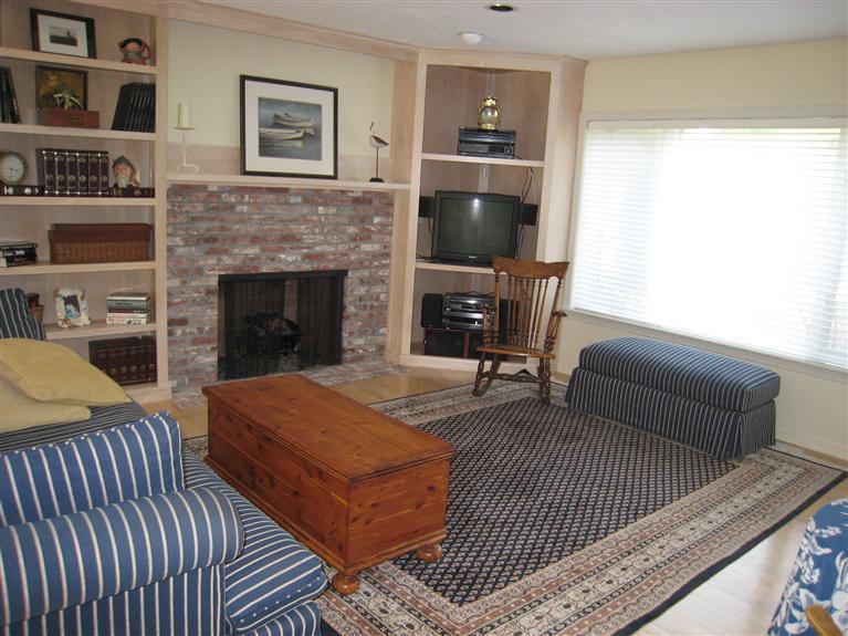 39 Summersea Road Mashpee, MA 02649 - Photo 8 of 18 a living room with furniture a flat screen tv and a fireplace