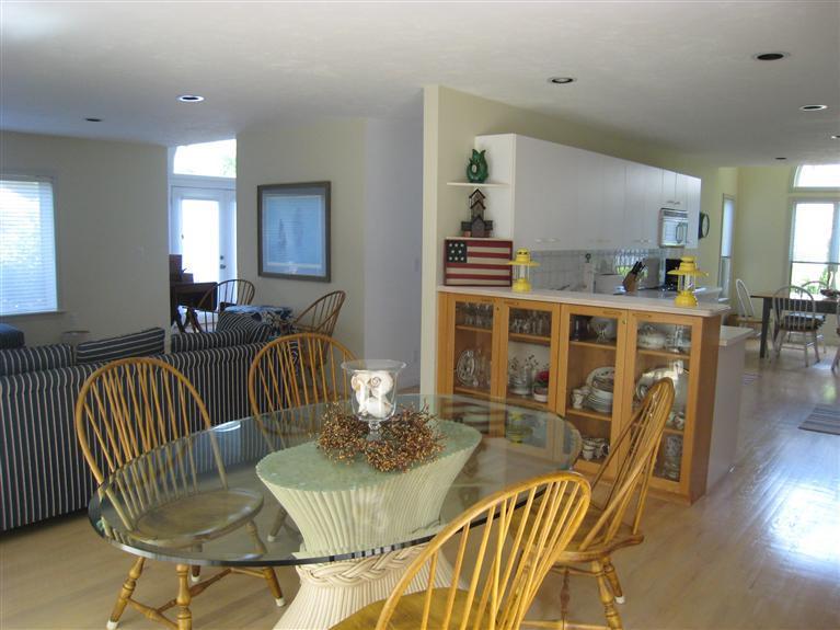 39 Summersea Road Mashpee, MA 02649 - Photo 10 of 18 a dining room with furniture a rug and wooden floor