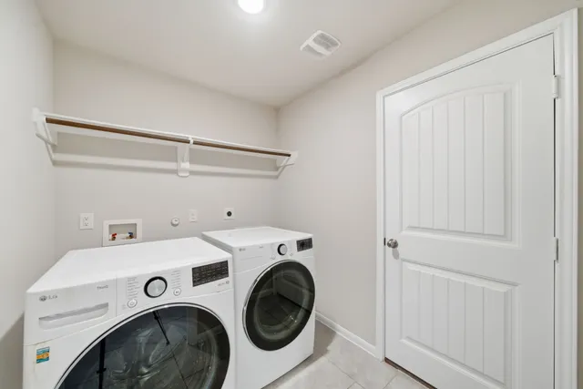 a view of a house with swimming pool and a yard