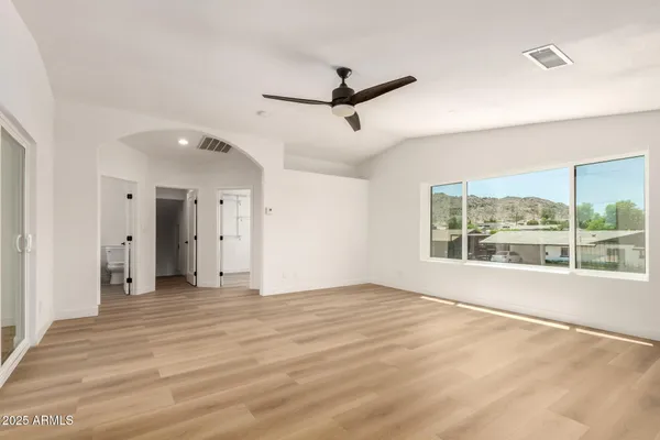 a view of an empty room with a window