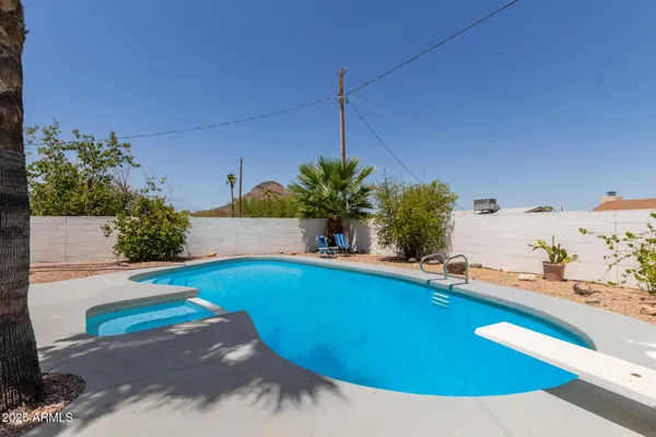 a view of a swimming pool with a patio
