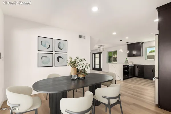 a view of a dining room with furniture and wooden floor