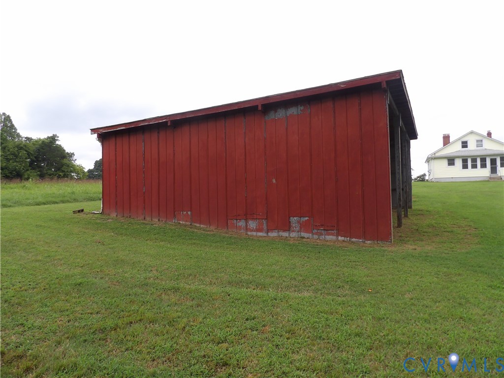 2137 Good Hope Road Crewe, VA 23930 - Photo 17 of 67 Red-painted wood-sided outbuilding with an angled