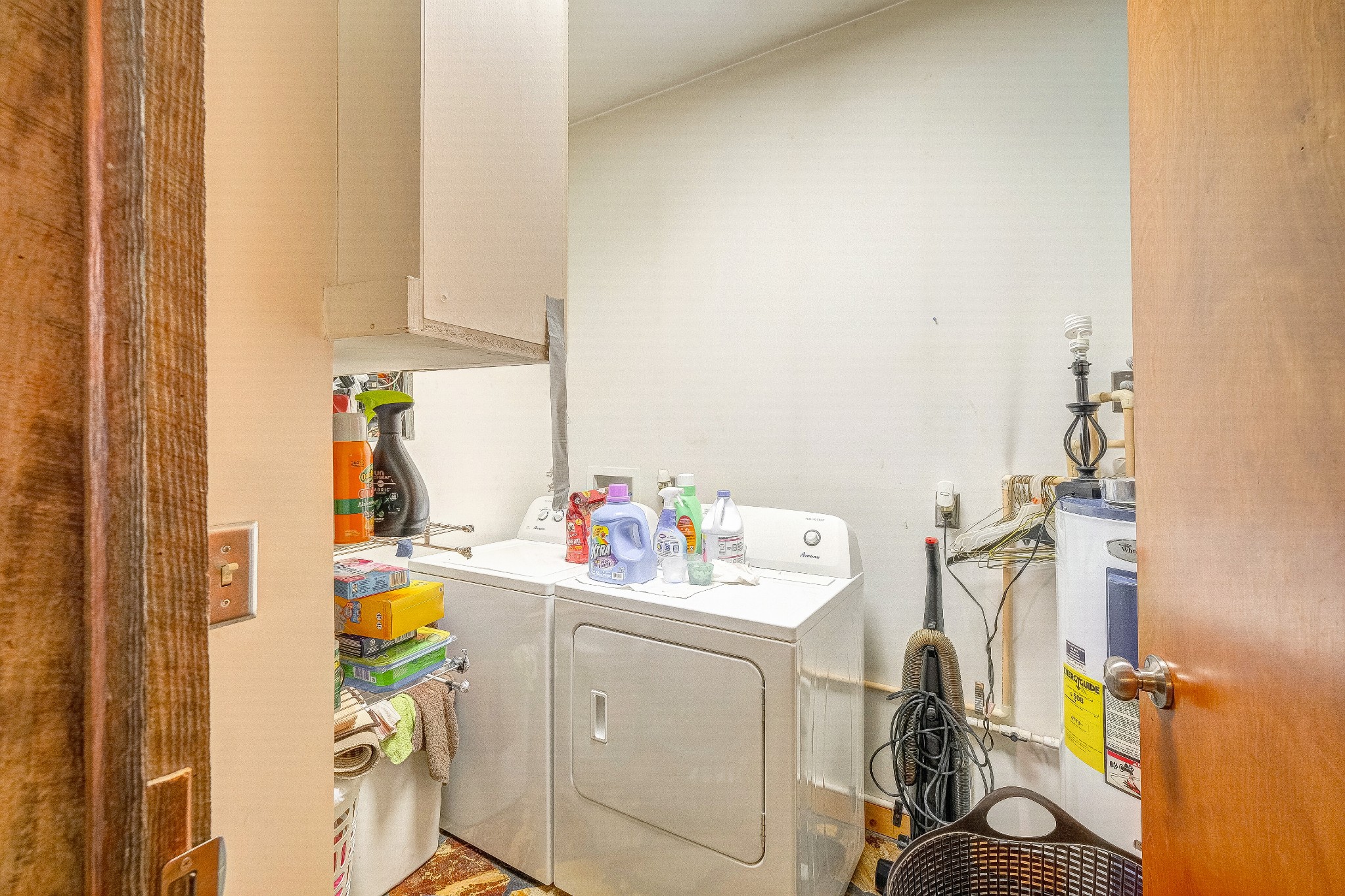 2419 Gideon Road Greenbrier, TN 37073 - Photo 14 of 50 a utility room with dryer washer and a view of living room