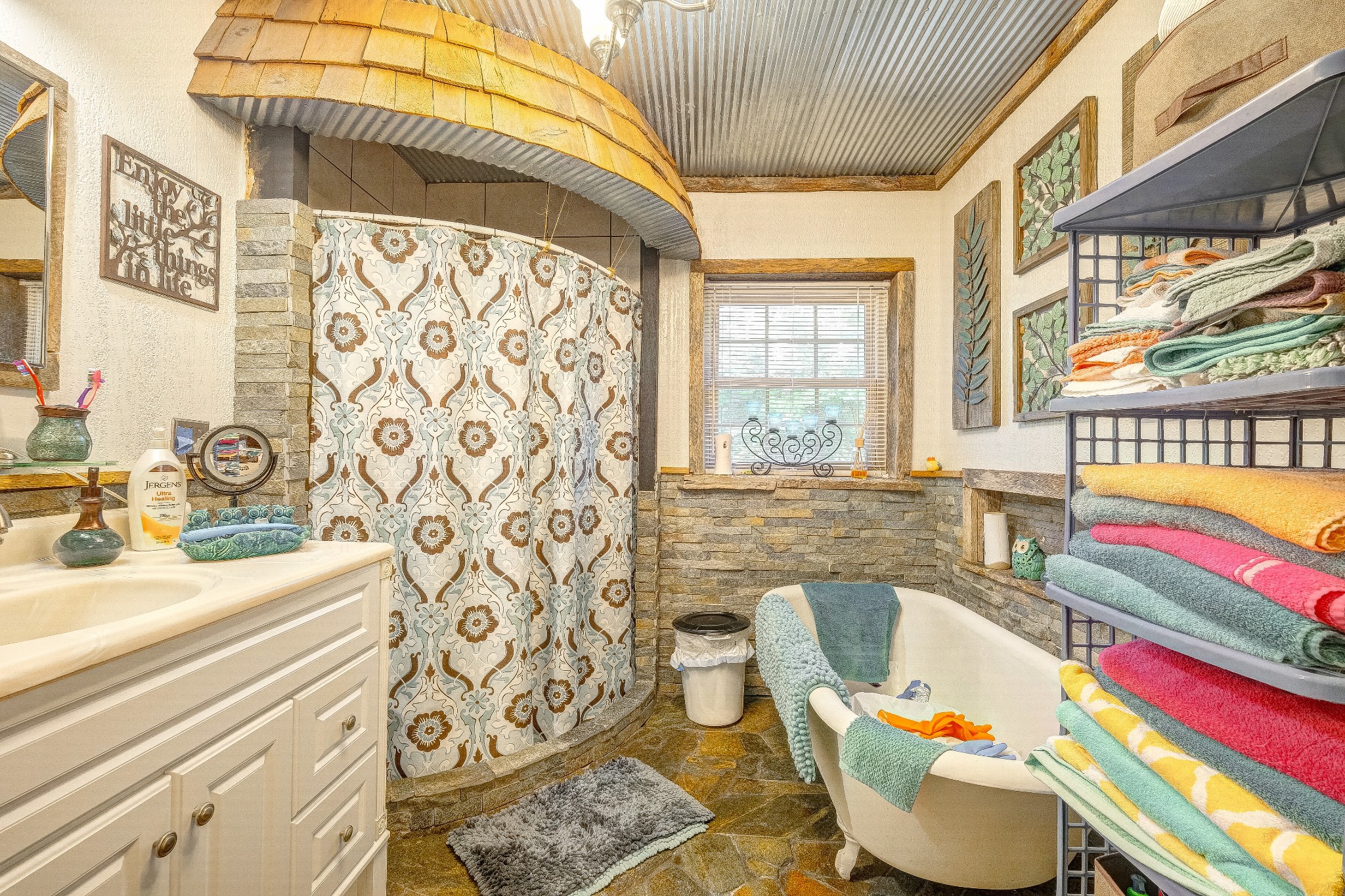 2419 Gideon Road Greenbrier, TN 37073 - Photo 22 of 50 a bathroom with a sink a bathtub and next to a window