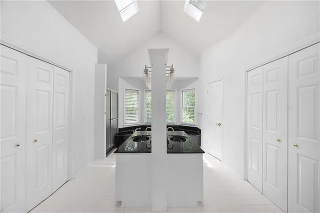 a kitchen with a sink stove and cabinets