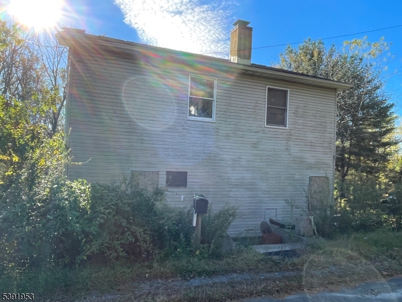 a view of a brick house with a yard