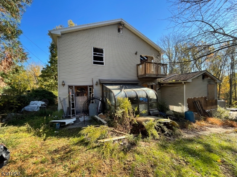 48 Cherry Tree Bend Road Port Murray, NJ 07865 - Photo 3 of 26 a view of backyard of house with car parked