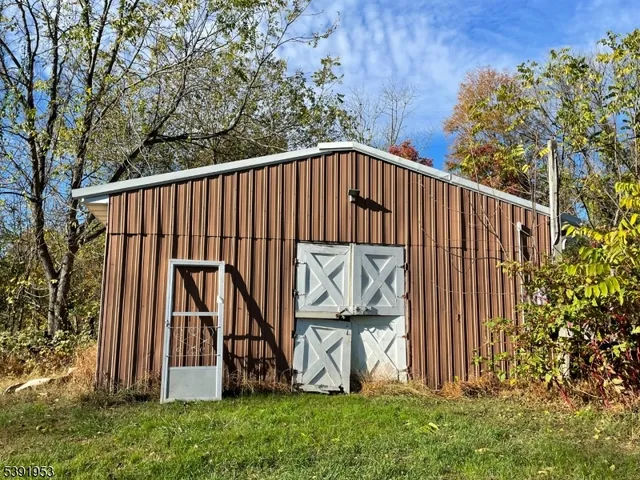 a view of wooden fence and a bench