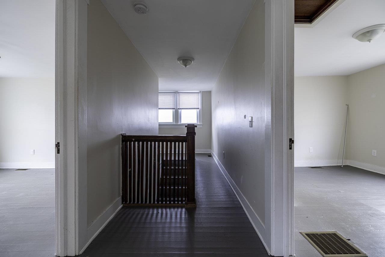 8120 Winestore Road Timberville, VA 22853 - Photo 18 of 35 a view of a hallway with wooden floor and staircase