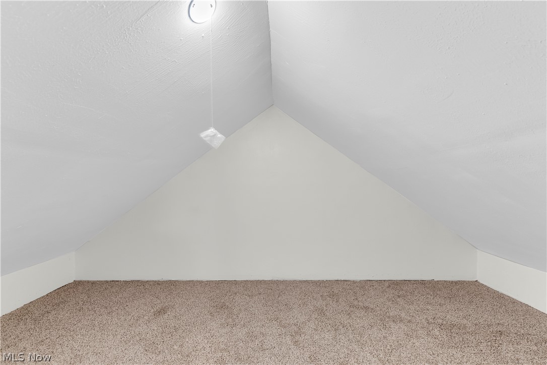 18155 Libby Road Maple Heights, OH 44137 - Photo 24 of 32 Attic space featuring neutral carpeting, sloped ceilings, white wall paint, and recessed lighting