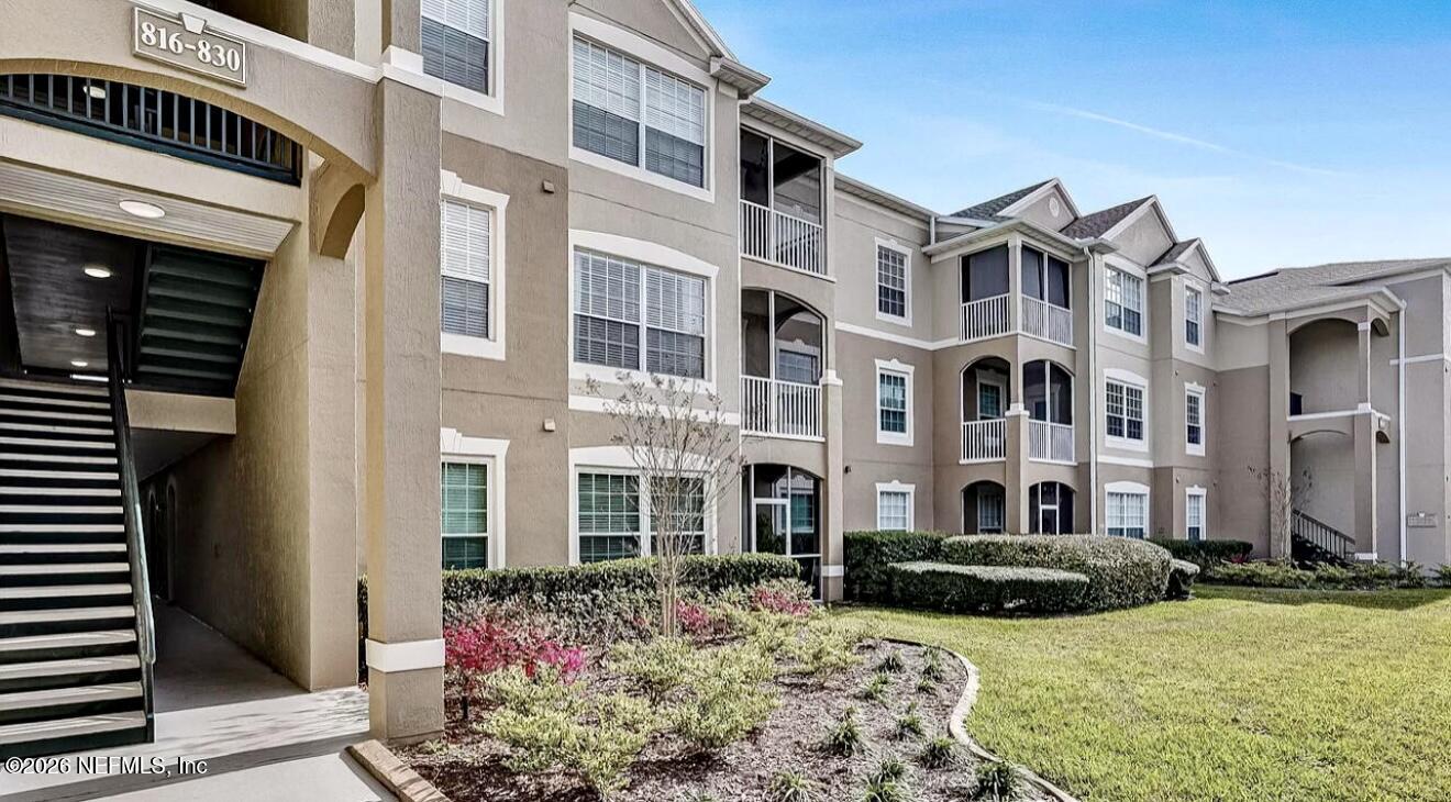 7990 Baymeadows Road, Unit 829 Jacksonville, FL 32256 - Photo 2 of 34 a view of a building with many windows