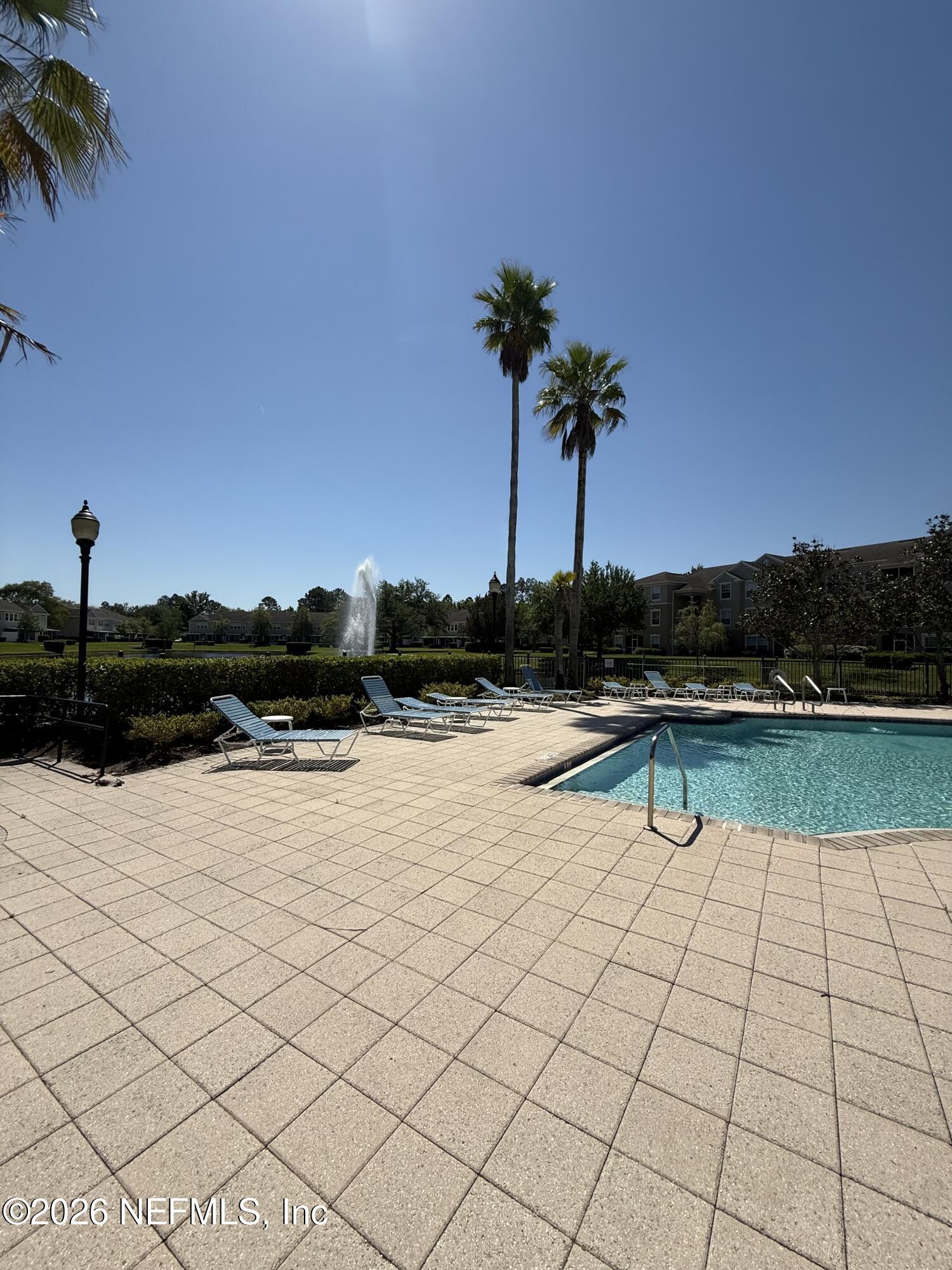 7990 Baymeadows Road, Unit 829 Jacksonville, FL 32256 - Photo 31 of 34 a view of lake with palm trees