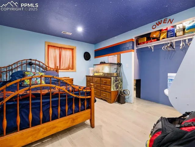 a bedroom with furniture and a window