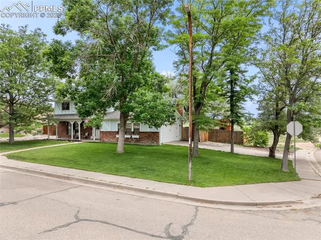 a view of a house with a garden