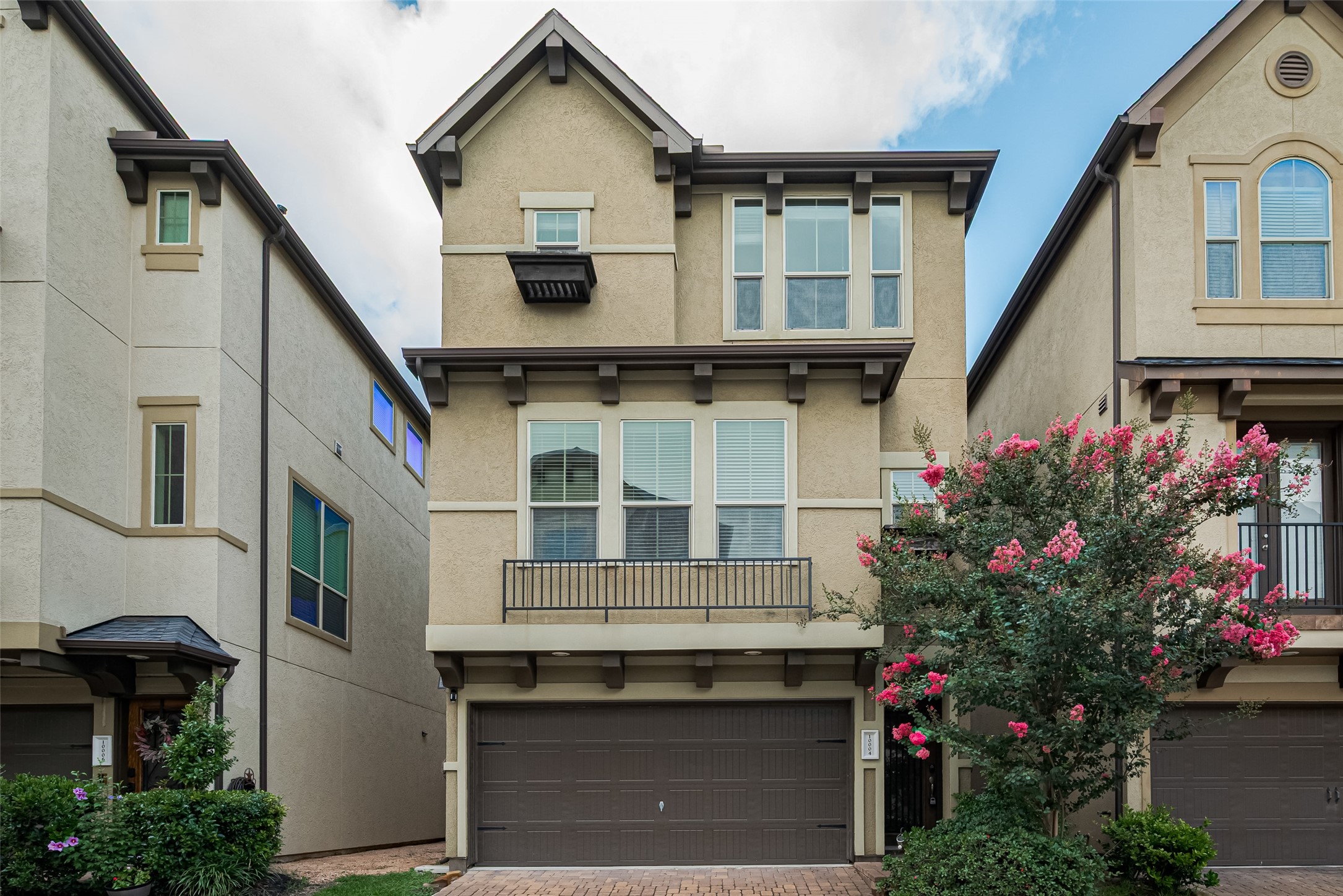 10004 Spring Shadows Park Circle Houston, TX 77080 - Photo 1 of 50 a front view of a house with a yard