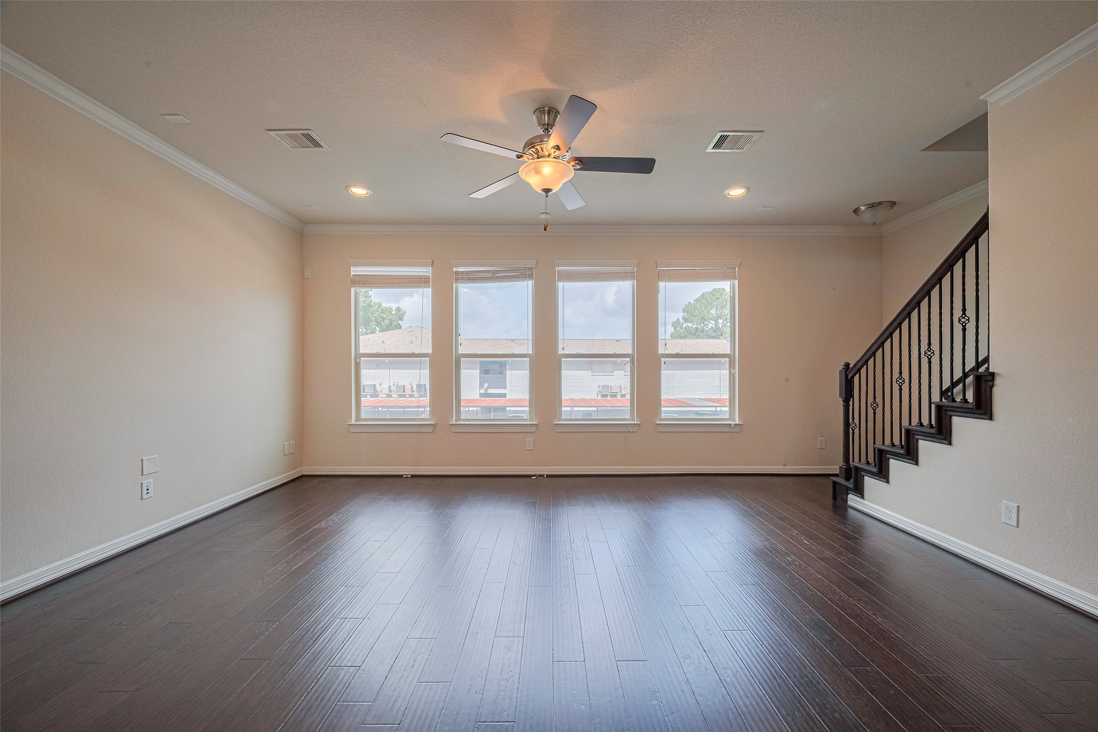 10004 Spring Shadows Park Circle Houston, TX 77080 - Photo 11 of 50 a view of an empty room with wooden floor and a window
