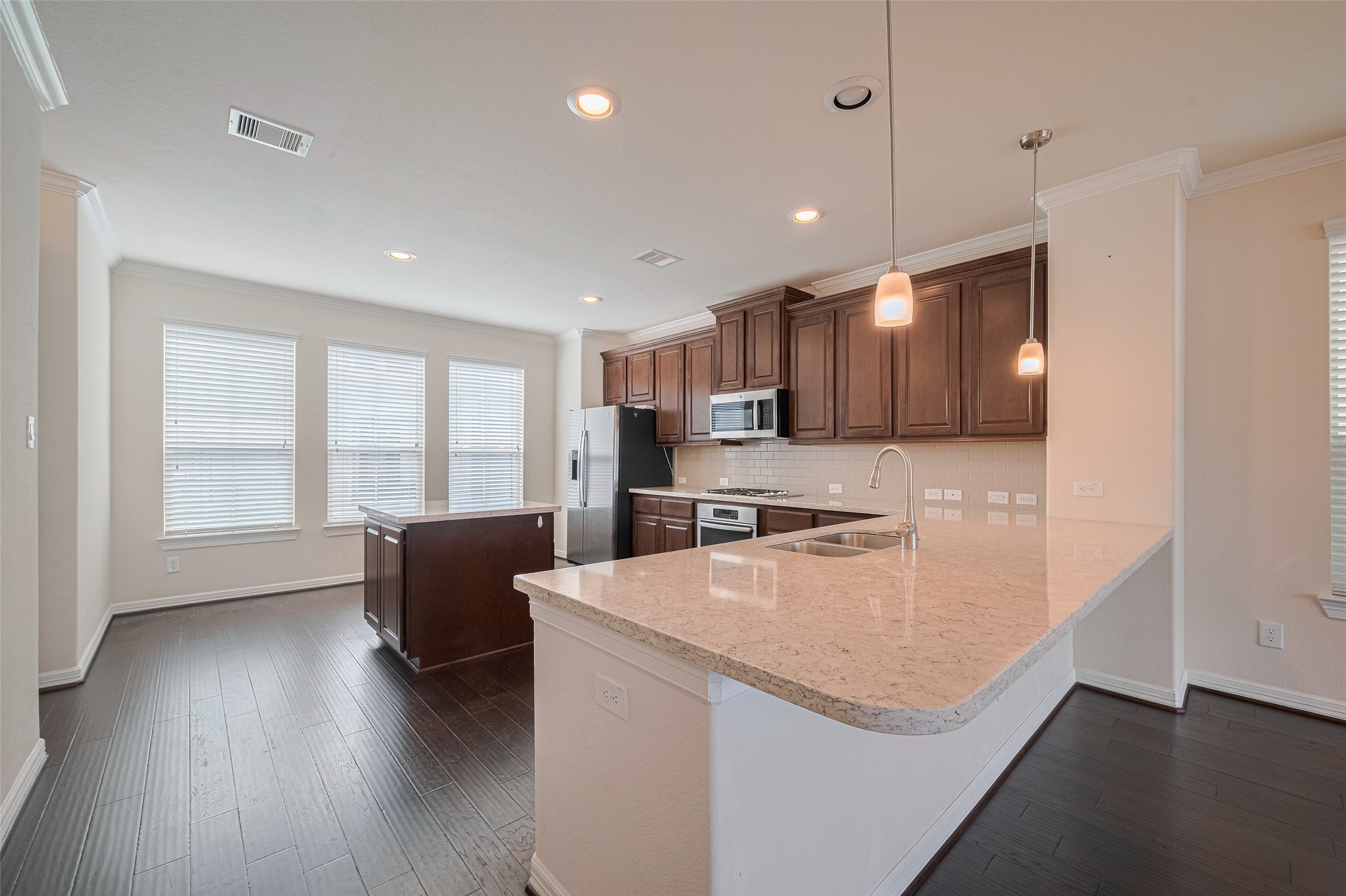 10004 Spring Shadows Park Circle Houston, TX 77080 - Photo 15 of 50 a view of kitchen with sink and wooden floor