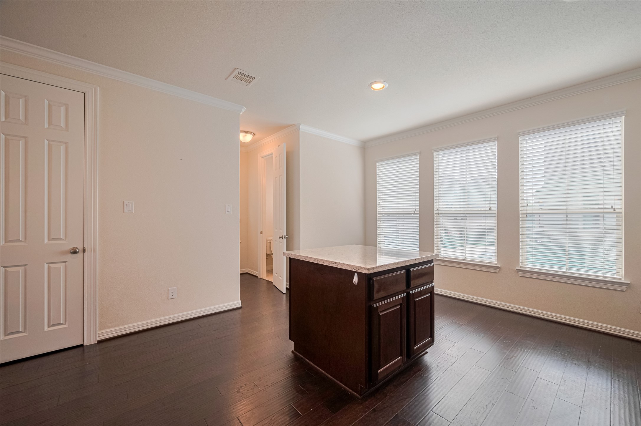 10004 Spring Shadows Park Circle Houston, TX 77080 - Photo 22 of 50 an empty room with wooden floor and windows