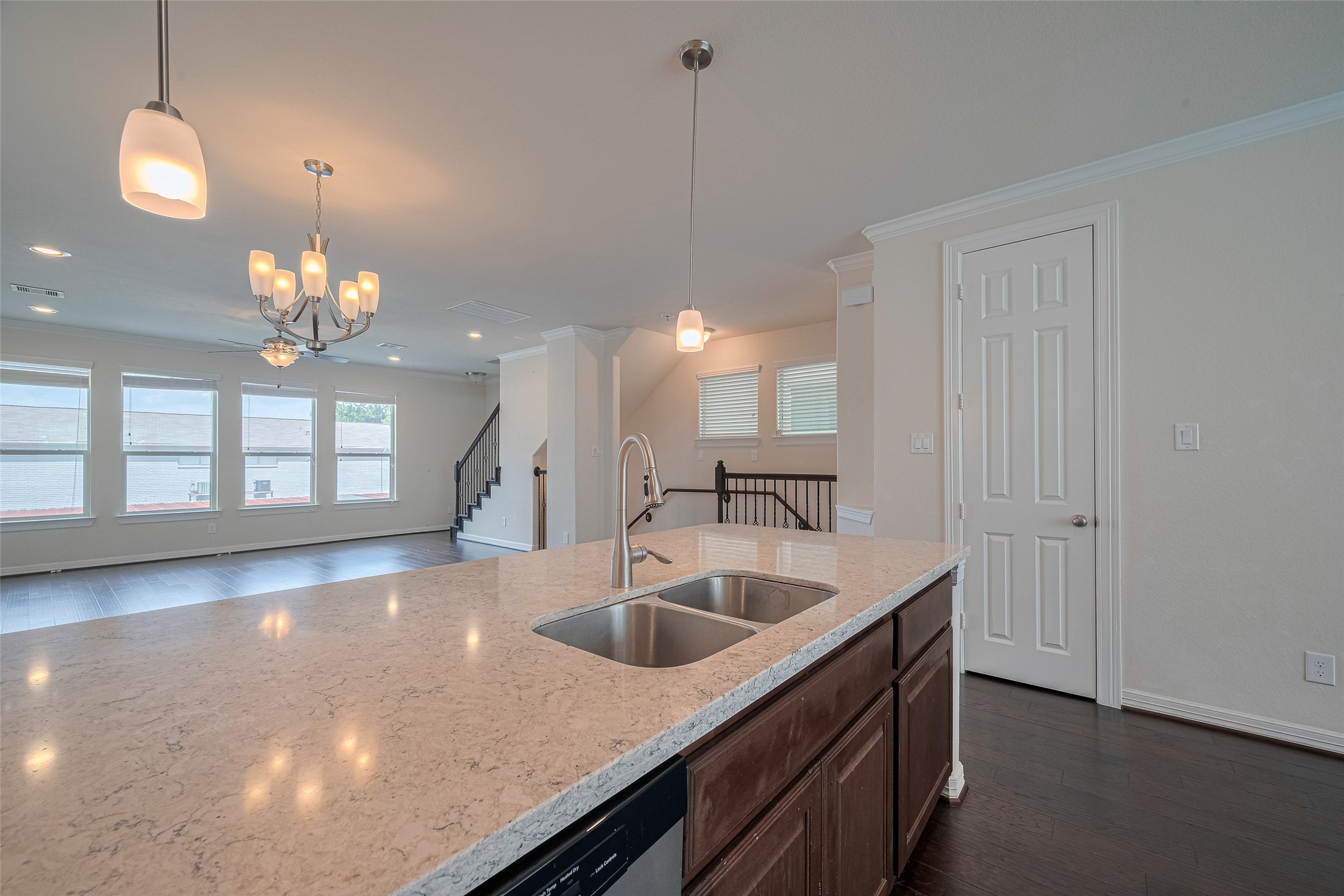 10004 Spring Shadows Park Circle Houston, TX 77080 - Photo 24 of 50 a kitchen with a sink and chandelier