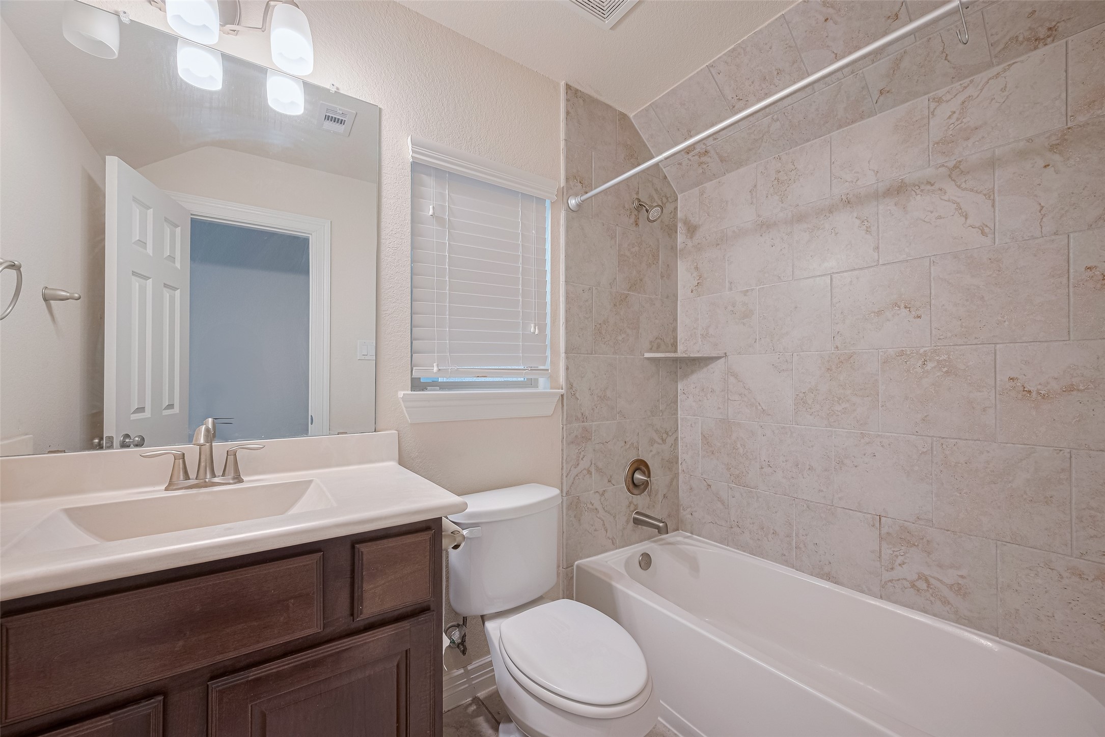 10004 Spring Shadows Park Circle Houston, TX 77080 - Photo 32 of 50 a bathroom with a sink toilet vanity and shower
