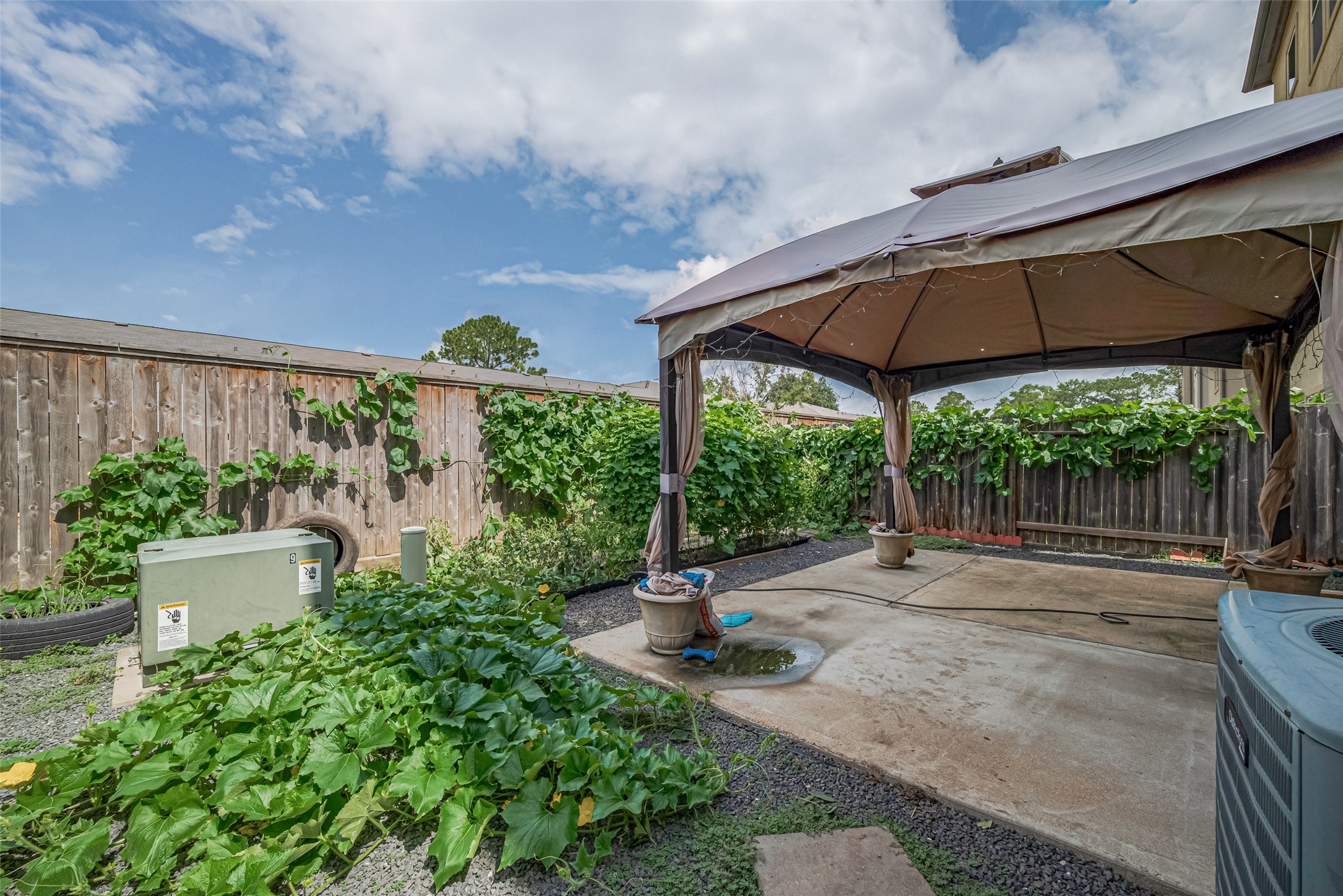 10004 Spring Shadows Park Circle Houston, TX 77080 - Photo 49 of 50 a view of a patio with a table and chairs under an umbrella